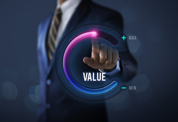 Growth value, increase value, value added or business growth con Growth value, increase value, value added or business growth concept. Businessman is pulling up circle progress bar with the word VALUE on dark tone background.